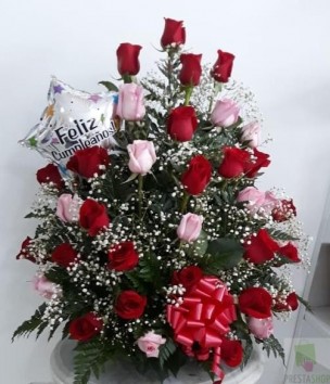 Arrangement of red and pink roses